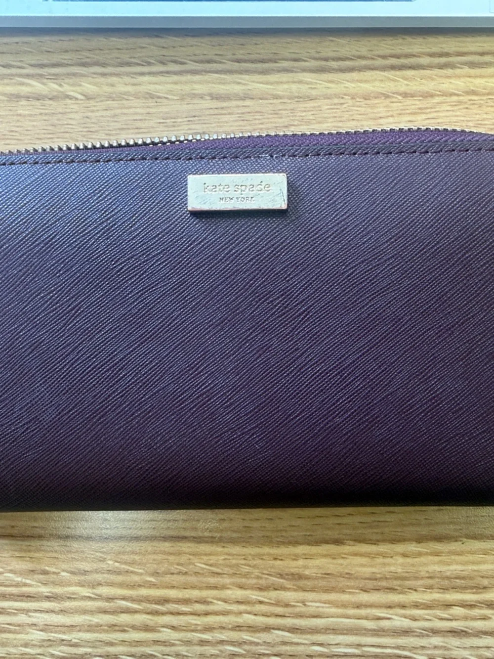 kate spade deep plum zip-around Saffiano wallet